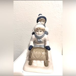 Vintage winter, children sledding porcelain figurine